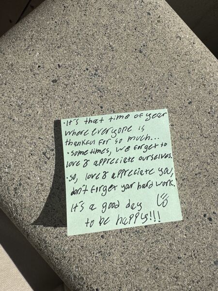 Handwritten sticky note with words of encouragement